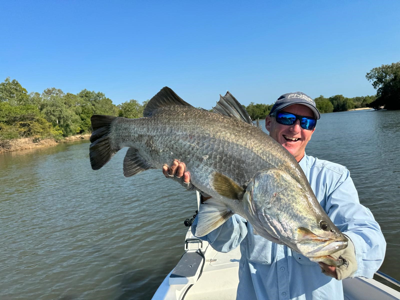 Fishing guide with huge Barramundi caught at remote Archer River Fishing guide with huge Barramundi caught at remote Archer River